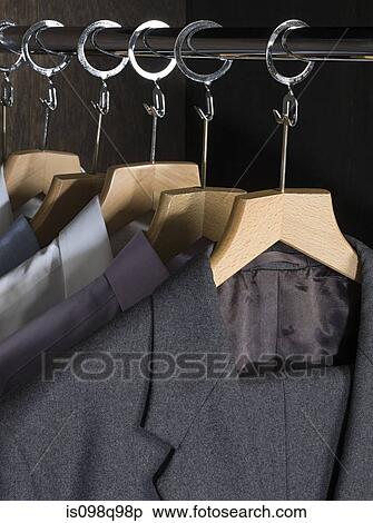 Shirts and suits in a closet View Large Photo Image Stock Photography - Shirts and suits in a closet. Fotosearch
