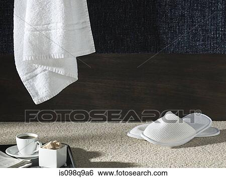 Slippers and a towel in a hotel room View Large Photo Image Stock Photograph - Slippers and a towel in a hotel room. Fotosearch