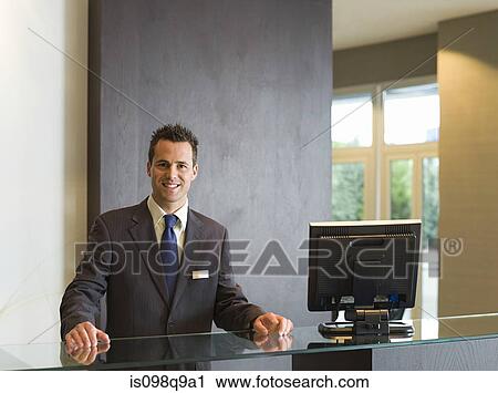 Smiling man in a hotel reception View Large Photo Image Stock Image - Smiling man in a hotel reception. Fotosearch
