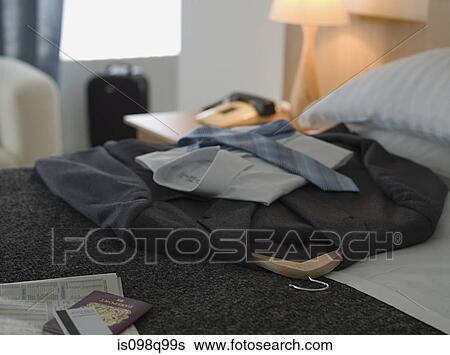 Suit on a hotel bed View Large Photo Image Stock Photograph - Suit on a hotel bed. Fotosearch