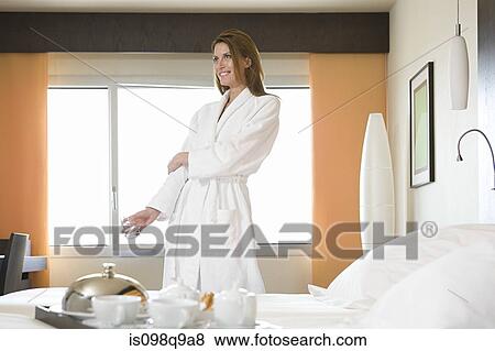 Stock Photo - Young woman wearing a bathrobe. Fotosearch
