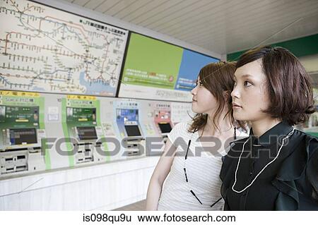 Friends in train station View Large Photo Image Stock Photograph - Friends in train station. Fotosearch