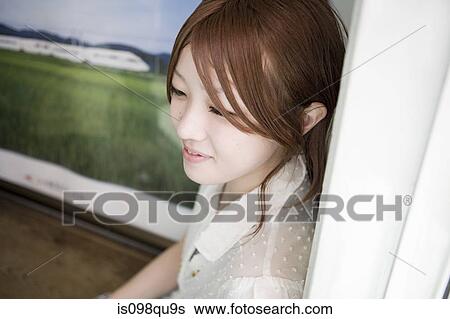 Young woman in waiting room View Large Photo Image Stock Photograph - Young woman in waiting room. Fotosearch