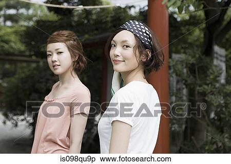 Stock Photography - Young women at shrine. Fotosearch