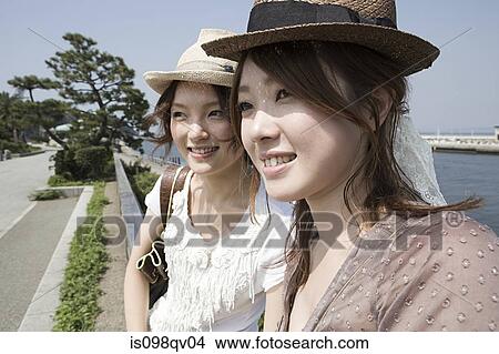 Picture - Young women at the coast. Fotosearch