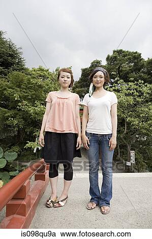 Young women in shrine garden View Large Photo Image Stock Image - Young women in shrine garden. Fotosearch