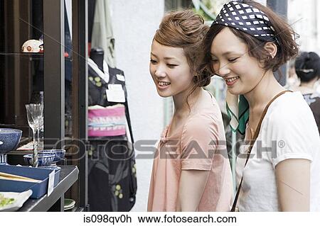 Young women shopping View Large Photo Image Stock Image - Young women shopping. Fotosearch