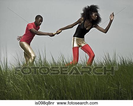 Athletes in relay race View Large Photo Image Stock Photography - Athletes in relay race. Fotosearch