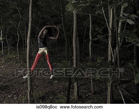 Female athlete in forest View Large Photo Image Stock Image - Female athlete in forest. Fotosearch