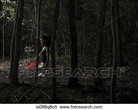 Stock Photography - Female athlete in forest. Fotosearch