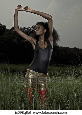 Stock Image - Female athlete stretching. Fotosearch