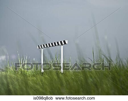 Stock Image - Hurdle in field. Fotosearch