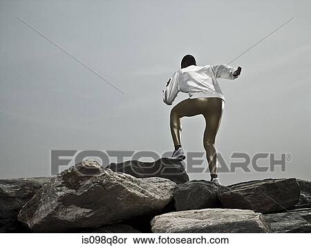 Male athlete on rocks View Large Photo Image Stock Photography - Male athlete on rocks. Fotosearch