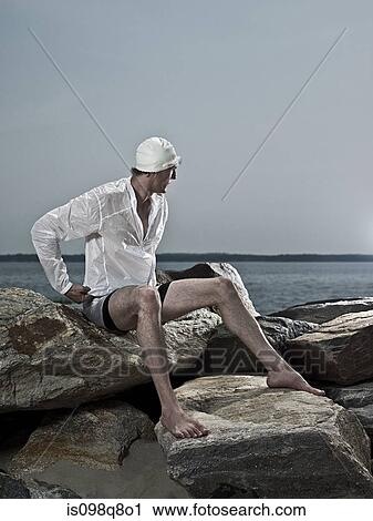 Swimmer on rocks View Large Photo Image Stock Image - Swimmer on rocks. Fotosearch