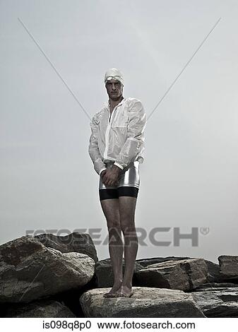 Swimmer on rocks View Large Photo Image Stock Image - Swimmer on rocks. Fotosearch