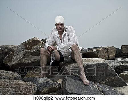 Swimmer on rocks View Large Photo Image Stock Image - Swimmer on rocks. Fotosearch