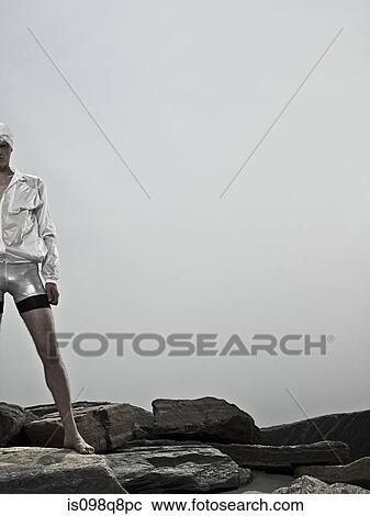 Swimmer on rocks View Large Photo Image Stock Image - Swimmer on rocks. Fotosearch