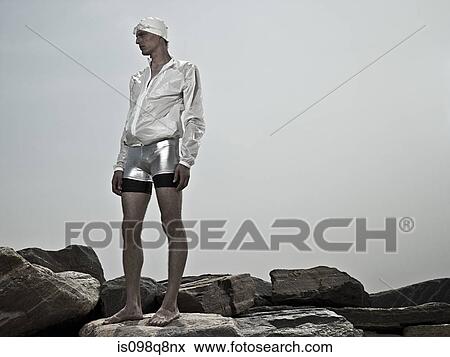 Swimmer on rocks View Large Photo Image Stock Photo - Swimmer on rocks. Fotosearch