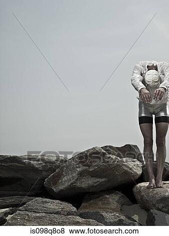 Swimmer on rocks View Large Photo Image Stock Photo - Swimmer on rocks. Fotosearch