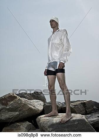 Swimmer on rocks View Large Photo Image Stock Photo - Swimmer on rocks. Fotosearch