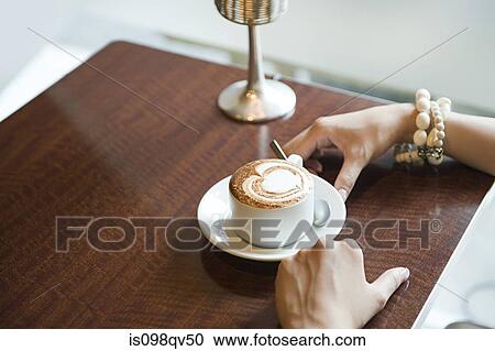 Woman having coffee View Large Photo Image Stock Image - Woman having coffee. Fotosearch