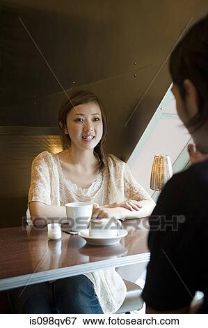 Young couple having coffee View Large Photo Image Stock Photo - Young couple having coffee. Fotosearch