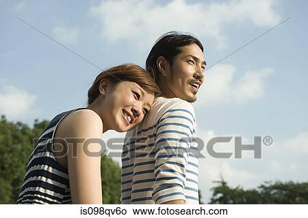 Young couple outdoors View Large Photo Image Picture - Young couple outdoors. Fotosearch