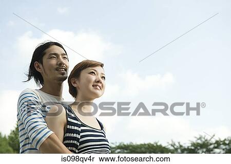 Young couple outdoors View Large Photo Image Stock Photography - Young couple outdoors. Fotosearch