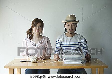 Young couple with string and magazines View Large Photo Image Stock Image - Young couple with string and magazines. Fotosearch
