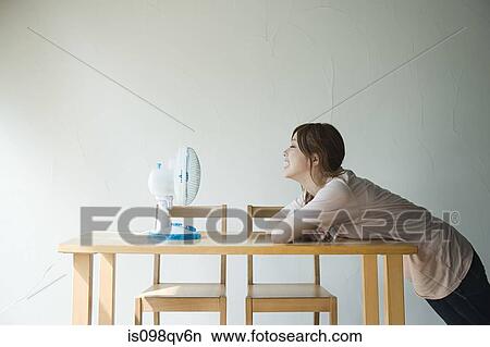 Young woman with fan View Large Photo Image Picture - Young woman with fan. Fotosearch