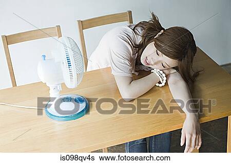 Stock Photograph - Young woman with fan. Fotosearch