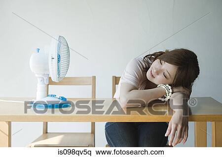 Young woman with fan View Large Photo Image Stock Photography - Young woman with fan. Fotosearch