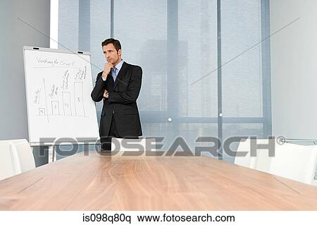 Businessman in meeting room View Large Photo Image Stock Photography - Businessman in meeting room. Fotosearch
