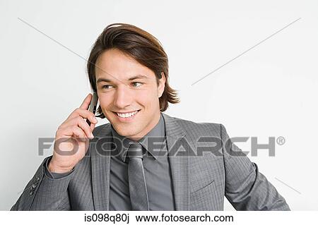 Stock Image - Businessman on cellphone. Fotosearch