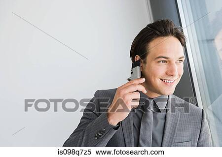 Businessman on cellphone View Large Photo Image Stock Photography - Businessman on cellphone. Fotosearch