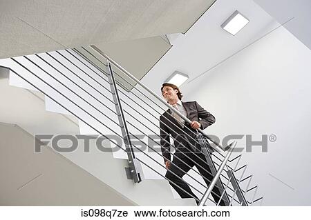 Businessman on stairs View Large Photo Image Stock Image - Businessman on stairs. Fotosearch