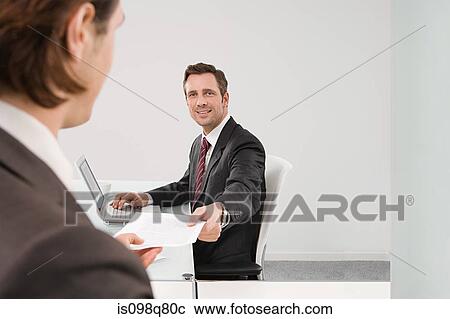 Stock Image - Businessmen in office. Fotosearch