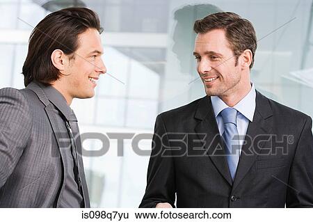 Businessmen in office View Large Photo Image Stock Photograph - Businessmen in office. Fotosearch