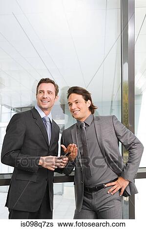Businessmen in office View Large Photo Image Stock Photograph - Businessmen in office. Fotosearch