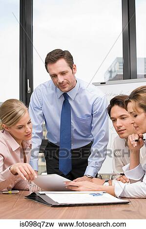 Businesspeople in meeting View Large Photo Image Stock Photo - Businesspeople in meeting. Fotosearch
