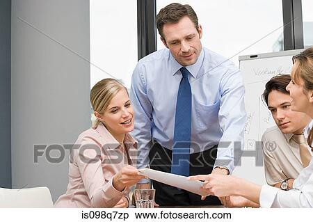 Stock Photography - Businesspeople in meeting. Fotosearch
