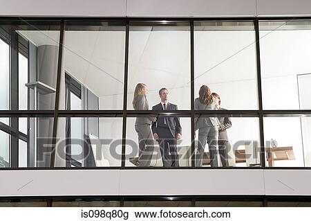 Businesspeople in office View Large Photo Image Stock Image - Businesspeople in office. Fotosearch