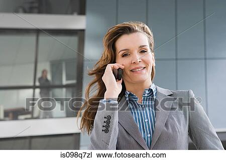 Businesswoman on cellphone View Large Photo Image Stock Image - Businesswoman on cellphone. Fotosearch