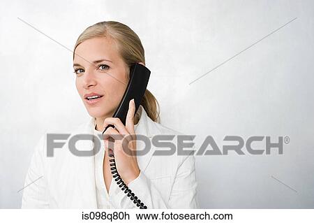 Stock Image - Businesswoman on telephone. Fotosearch