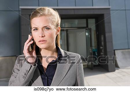 Businesswoman with cellphone View Large Photo Image Picture - Businesswoman with cellphone. Fotosearch