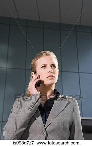 Businesswoman with cellphone View Large Photo Image Stock Photo - Businesswoman with cellphone. Fotosearch