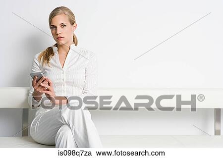 Stock Image - Businesswoman with handheld computer. Fotosearch