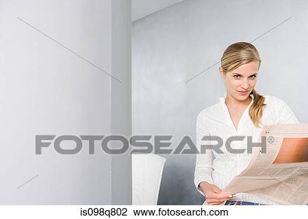 Businesswoman with newspaper View Large Photo Image Stock Image - Businesswoman with newspaper. Fotosearch