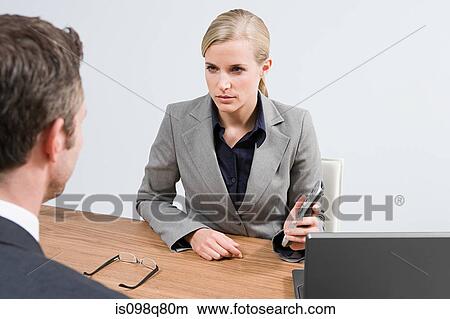 Businesswoman with remote control View Large Photo Image Picture - Businesswoman with remote control. Fotosearch