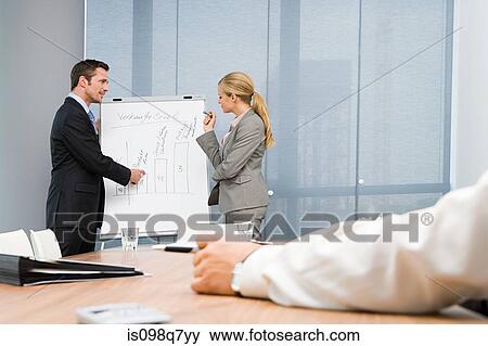 Colleagues giving presentation View Large Photo Image Stock Photo - Colleagues giving presentation. Fotosearch